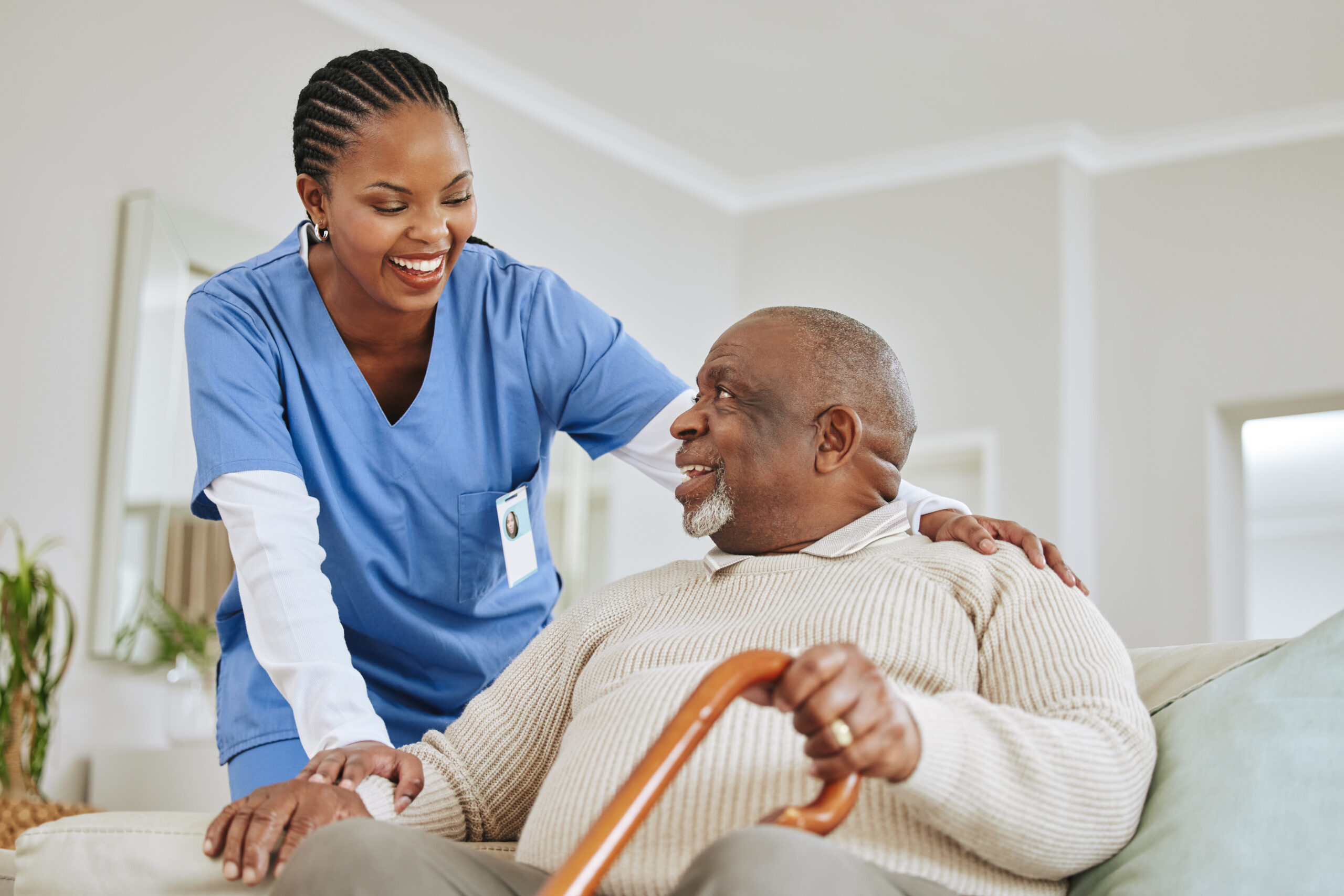 getting old is inevitable. shot of a nurse speaking to her male patient